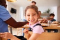 Portrait Of Granddaughter As Multi-Generation Mixed Race Family Eat Meal Around Table At Home Royalty Free Stock Photo