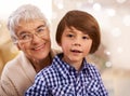 Portrait, grandmother and Christmas with a boy, child and festive season with hug and family. Face, embrace and elderly