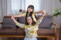 Portrait of a grandmother and granddaughter doing home activities and showing love for one another to create warmth and love Royalty Free Stock Photo