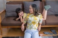 Portrait of a grandmother and granddaughter doing home activities and showing love for one another to create warmth and love Royalty Free Stock Photo