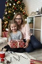 Portrait of grandmother and granddaughter embracing during the Christmas holidays Royalty Free Stock Photo