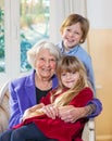 Portrait of a grandmother with her grandchildren.