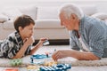 Portrait Grandpa and Grandson Playing with Toys