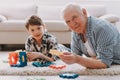 Portrait Grandpa and Grandson Playing with Toys