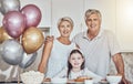 Portrait, grandparents or girl in celebration of a happy birthday in house party or kitchen with popcorn or cake