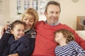 Portrait grandparents and grandchildren at home