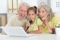 Portrait of grandparents with granddaughter singing karaoke Royalty Free Stock Photo