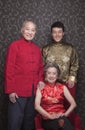 Portrait grandparents and grandson in traditional Chinese clothing