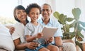 Portrait, grandparents and kid smile with tablet in home living room on sofa, bonding or having fun. Family, happiness