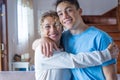 Portrait of grateful teenager man hug smiling middle-aged mother show love and care, thankful happy grown-up son in embrace Royalty Free Stock Photo