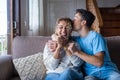 Portrait of grateful teenager man hug smiling middle-aged mother show love and care, thankful happy grown-up son in embrace