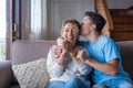 Portrait of grateful teenager man hug smiling middle-aged mother show love and care, thankful happy grown-up son in embrace Royalty Free Stock Photo