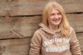 Portrait of green-eyed blonde girl wearing sweater Royalty Free Stock Photo