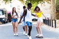 Group of active teenagers making recreational activity in an urban area. Royalty Free Stock Photo