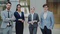 Portrait of group of business people smiling in modern office. Team of businessmen and businesswomen standing together Royalty Free Stock Photo