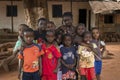 Portrait of a group of children in front of a house in the in the town of Nhacra