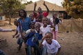 Portrait of a group of children playing and smiling, at the Bissaque neighborhood in the city of Bissau