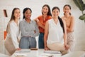 Portrait of a group of confident diverse business women posing together in an office boardroom. Happy smiling colleagues Royalty Free Stock Photo