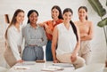 Portrait of a group of confident diverse business women posing together in an office boardroom. Happy smiling colleagues Royalty Free Stock Photo