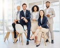 Portrait of a group of confident diverse businesspeople posing together in an office. Happy smiling colleagues motivated Royalty Free Stock Photo