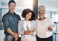 Portrait of a group of confident diverse businesspeople standing in an office. Happy smiling colleagues motivated and Royalty Free Stock Photo