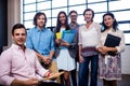 Portrait of a group of coworkers holding folders Royalty Free Stock Photo