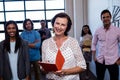 Portrait of a group of coworkers holding folders Royalty Free Stock Photo