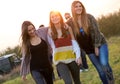 Portrait of group of friends having fun in field. Royalty Free Stock Photo