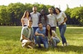 Group of young happy smiling people friends standing in the summer park. Royalty Free Stock Photo