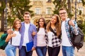 Portrait of group of happy students showing thumbs up Royalty Free Stock Photo