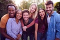 Portrait Of Group Of Multi-Cultural Friends Enjoying Outdoor Summer Garden Party Royalty Free Stock Photo