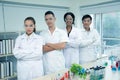 Portrait group multi-ethnic scientists standing smiling happily and cross one\'s arm in laboratory,conducting scientific Royalty Free Stock Photo