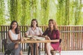 Group of three best friend having their lunch together at a cafe Royalty Free Stock Photo