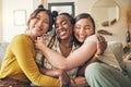 Portrait of a group of women, friends hug on sofa with smile and bonding in living room together in embrace. Hug, love