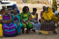 Portrait of a group of women wearing colorful dresses at a community reunion in the Bissaque neighborhood in the city of Bissau