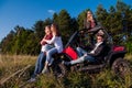 Group of young people driving a off road buggy car Royalty Free Stock Photo