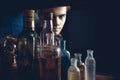 Portrait of a guy with bottles in steampunk style. Royalty Free Stock Photo