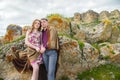 Portrait of a guy with a girl covered in a blanket standing in an embrace in nature and smiling with happiness Royalty Free Stock Photo