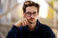 Portrait of a guy with glasses posing outdoors Royalty Free Stock Photo