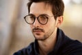 Portrait of a guy with glasses posing outdoors Royalty Free Stock Photo