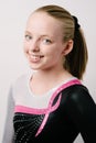 A portrait of a gymnast on a white background.