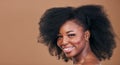 Portrait, hair care and black woman with natural beauty, shine and smile on a brown studio background. Mockup space Royalty Free Stock Photo