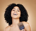 Portrait, hair care and woman with a comb, afro and salon treatment with volume on brown background. Face, person or Royalty Free Stock Photo