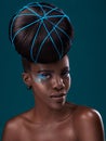 Portrait, hair and fashion with a model black woman in studio on a blue background for beauty. Face, haircare and Royalty Free Stock Photo