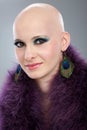 Portrait of hairless woman in purple boa Royalty Free Stock Photo