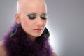 Portrait of hairless woman in purple boa Royalty Free Stock Photo