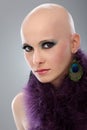 Portrait of hairless woman in purple boa Royalty Free Stock Photo