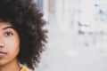 Portrait of half a face of one young beautiful African or American woman looking at the camera. Close up of eye of afro girl, copy Royalty Free Stock Photo