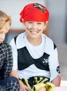 Portrait, halloween and a boy in a pirate costume for a trick or treat tradition outdoor in his neighborhood. Kids Royalty Free Stock Photo