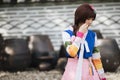 Portrait of Hanbok costume young woman in korean park